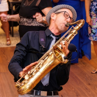 John playing saxophone